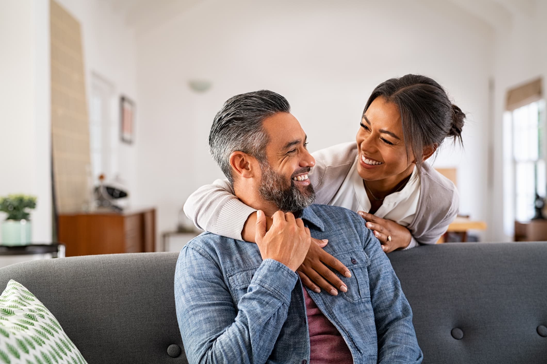 Couple smiling together at home