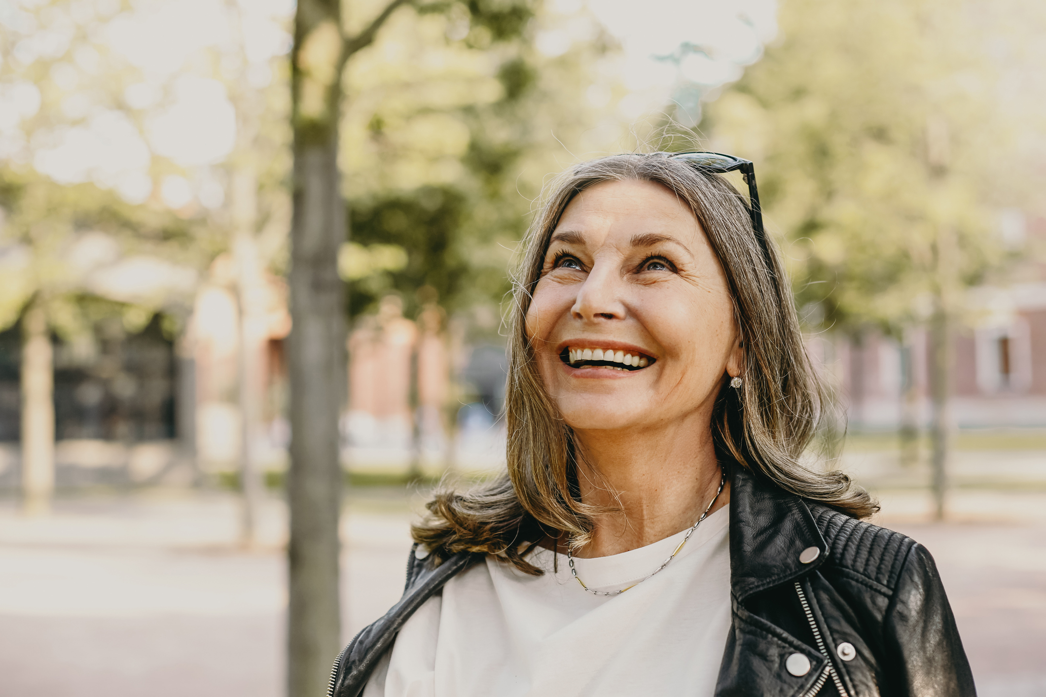 Older woman with kind eyes, contemplative